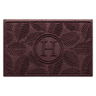 WaterHog 2x3 Deanna, all-weather monogram doormat with a deep wine red leafy design, on a water-resistant surface.