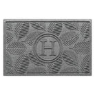 Personalized WaterHog medium Deanna doormat in a light grey leafy design on an eco-friendly, durable surface.