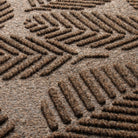 Detail shot of the stain-resistant WaterHog surface fibers made of light and dark brown, white, and black fibers.