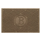 Overhead of a monogrammed Diamonds indoor/outdoor doormat with a light tan crisscrossing linear, bi-level design.