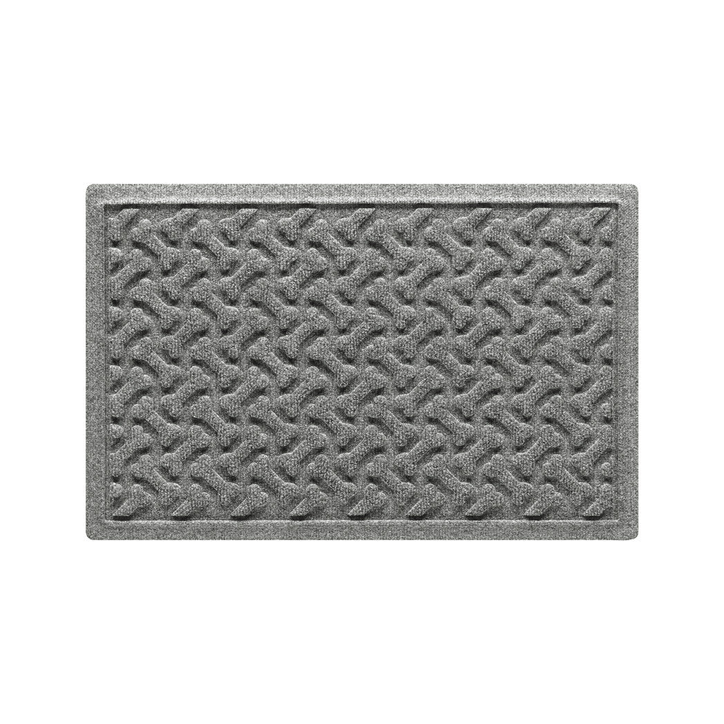 A 18x27 WaterHog Dog Bones bowl mat overhead, in a light grey surface and durable rubber backing.