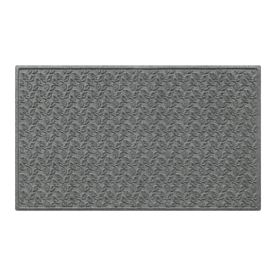 Stain-resistant doormat in grey with a leafy pattern shown in 3x5 on a white background