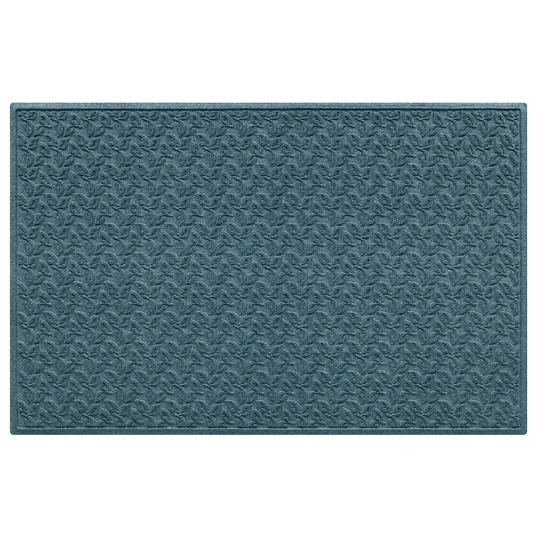 Creamy blue large doormat with a repetitive leafy pattern on an eco-friendly surface