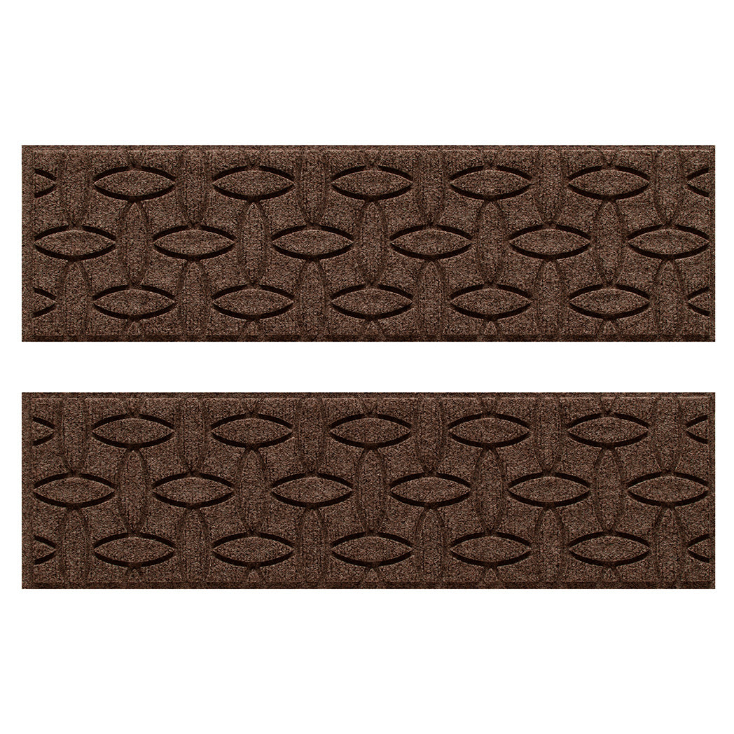 Protective WaterHog indoor/outdoor stair treads in a dark earthy brown interlocking elliptical pattern.