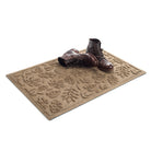 Angled 2x3 WaterHog Fall Day doormat shown in a tan with a pair of brown leather boots placed on top.