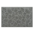 Overhead of a WaterHog medium-sized premium doormat in a light grey color with a fallen leaves, bi-level pattern.