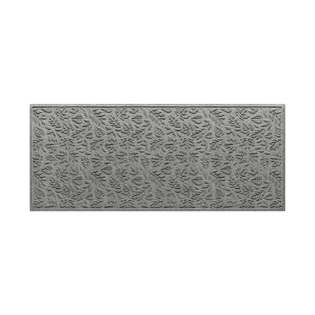 A WaterHog 3x7 indoor/outdoor luxury runner in a light grey fallen leaves design.