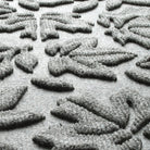 Close-up of Fall Day's water-resistant surface creating a light grey, long-lasting doormat.