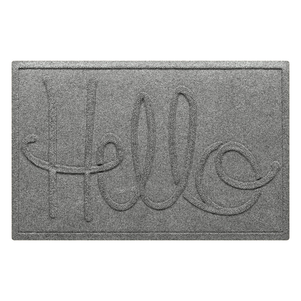 A WaterHog Hello front door mat in a light grey color with an elevated design that spells hello.