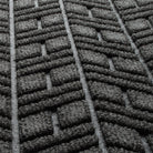 Close-up of the eco-friendly WaterHog surface fibers made of various shades of grey to black, with hints of white strands.