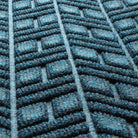 Close-up of the all-weather WaterHog surface fibers made of dark and light blues, white and grey strands.