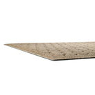 A side-profile shot of the WaterHog Honeycomb doormat in tan, displaying the low-profile properties of the mat.