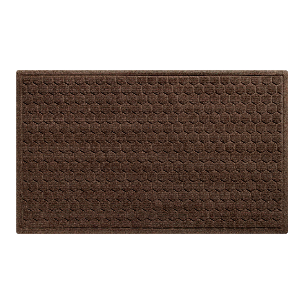 A WaterHog Honeycomb indoor/outdoor doormat in dark brown, featuring a hexagonal pattern displayed on a white background.