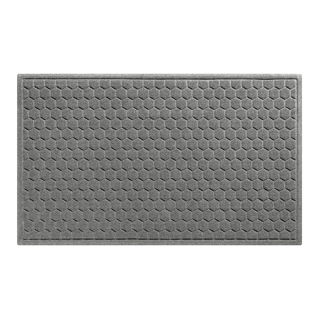 A large 3x5 WaterHog Honeycomb all-weather doormat in light grey, featuring a hexagonal pattern displayed on a white background