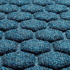 A close-up shot of the WaterHog Honeycomb all-weather doormat in navy, displaying the fibers that make up the raised design.