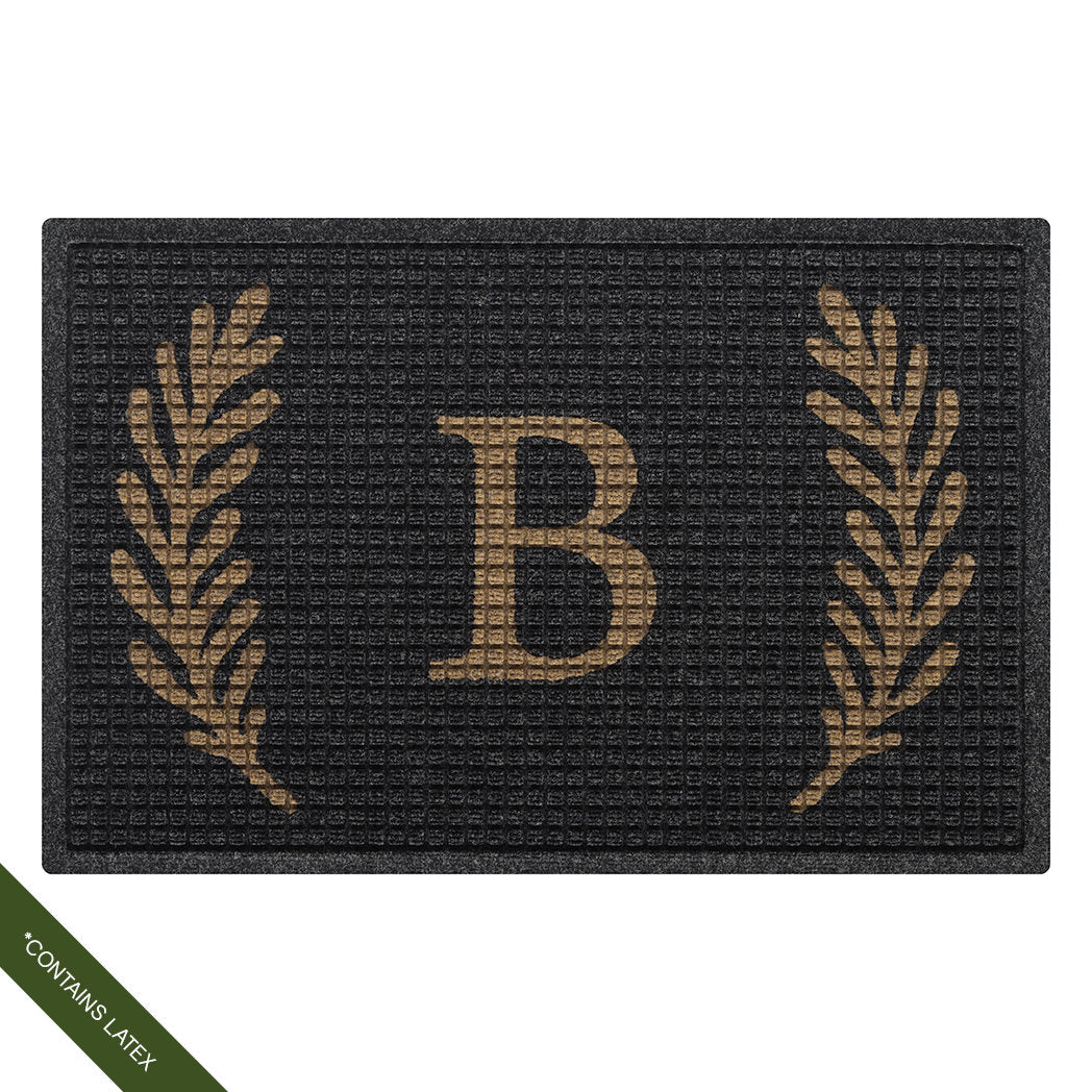 Two by three foot charcoal WaterHog Squares doormat personalized with a capitalized serif 'B' in tan with a laurel design; latex declaimer
