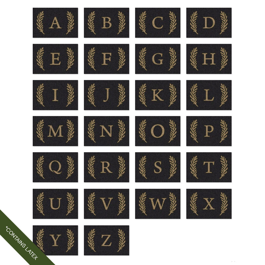 Examples of the capital serif A-Z WaterHog Inlay doormats with a laurel design