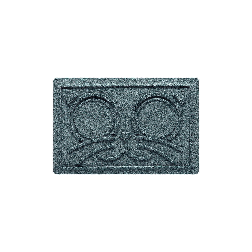 Overhead of a small WaterHog Kitty Face bowl mat in a light blue/grey surface.