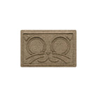 A small-sized WaterHog Kitty Face bowl mat overhead, in a light tan color and fast-drying surface.