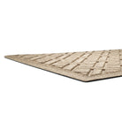 A low and close shot of WaterHog Lattice doormat's no snag, low-profile and durable rubber backing.