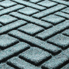 Detail shot of WaterHog's Lattice bi-level surface made of light blue, grey, and white fibers.