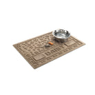 Angled WaterHog Paws & Bones personalized bowl mat in medium grey with a water bowl and dog treats on top.