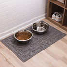 A large, medium grey Paws and Bones pet bowl mat with the name Cooper on it along with water and food dishes.