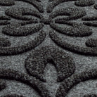 A close-up shot of the WaterHog Pheonix Indoor/Outdoor doormat in a dark grey, displaying the mixture of dark grey and white carpeted fibers that make up the top of the mat.