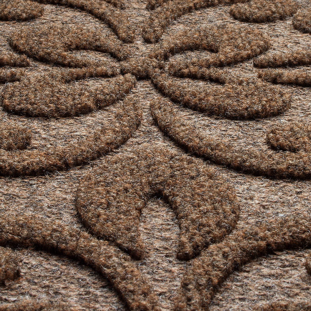 A close-up shot of the WaterHog Pheonix Indoor/Outdoor doormat in dark brown, displaying the mixture of brown, grey, and white carpeted fibers that make up the top of the mat.