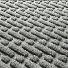 Blown-up view of the fade-resistant WaterHog surface creating a light grey, durable long-lasting doormat.