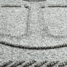 A zoomed-in shot of the WaterHog Ship's Anchor durable doormat in light grey, showcasing the raised design composed of carpeted fibers.