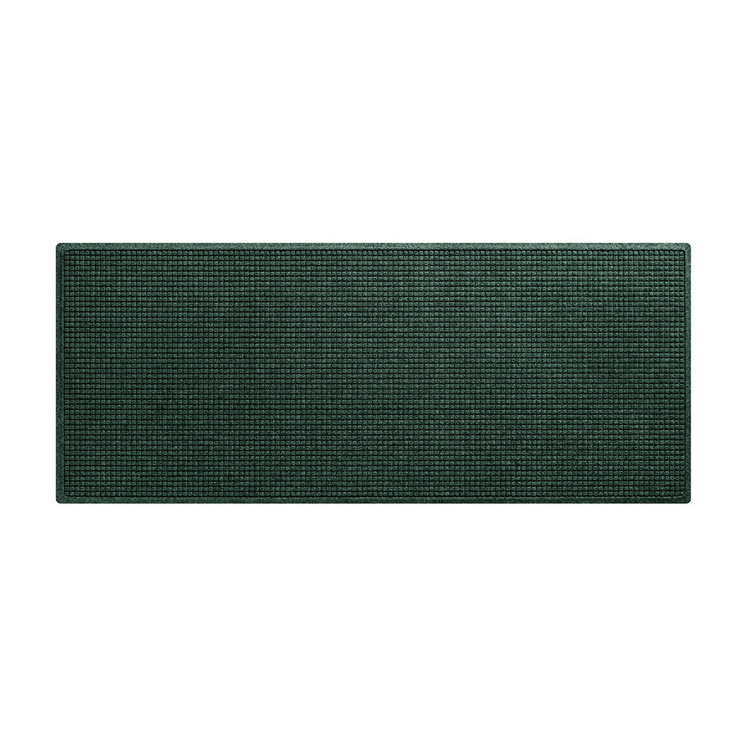 An overhead of a WaterHog Squares runner made with an eco-friendly surface and backed by durable rubber, shown in a chalky green color.