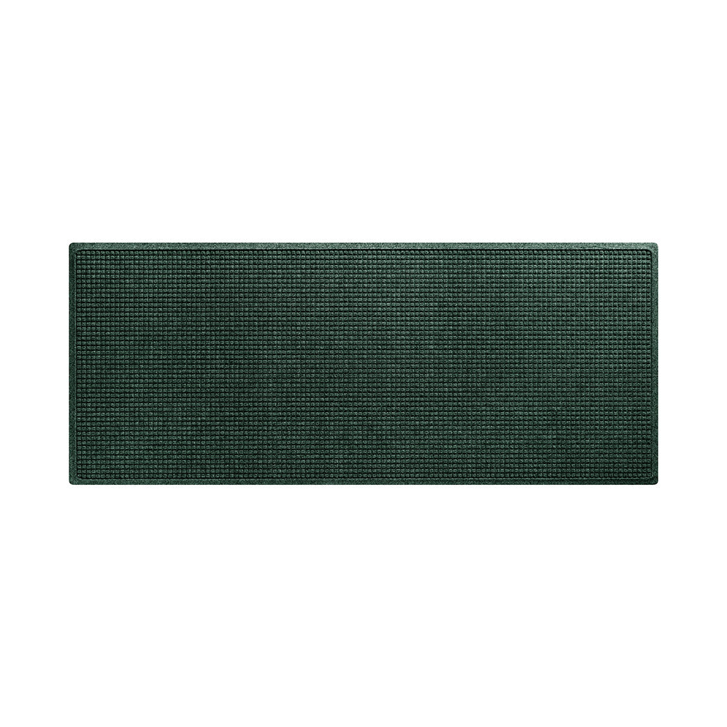 Overhead of a deep earthy green WaterHog indoor/outdoor medium runner mat with a grid-like bi-level eco-friendly PET surface.