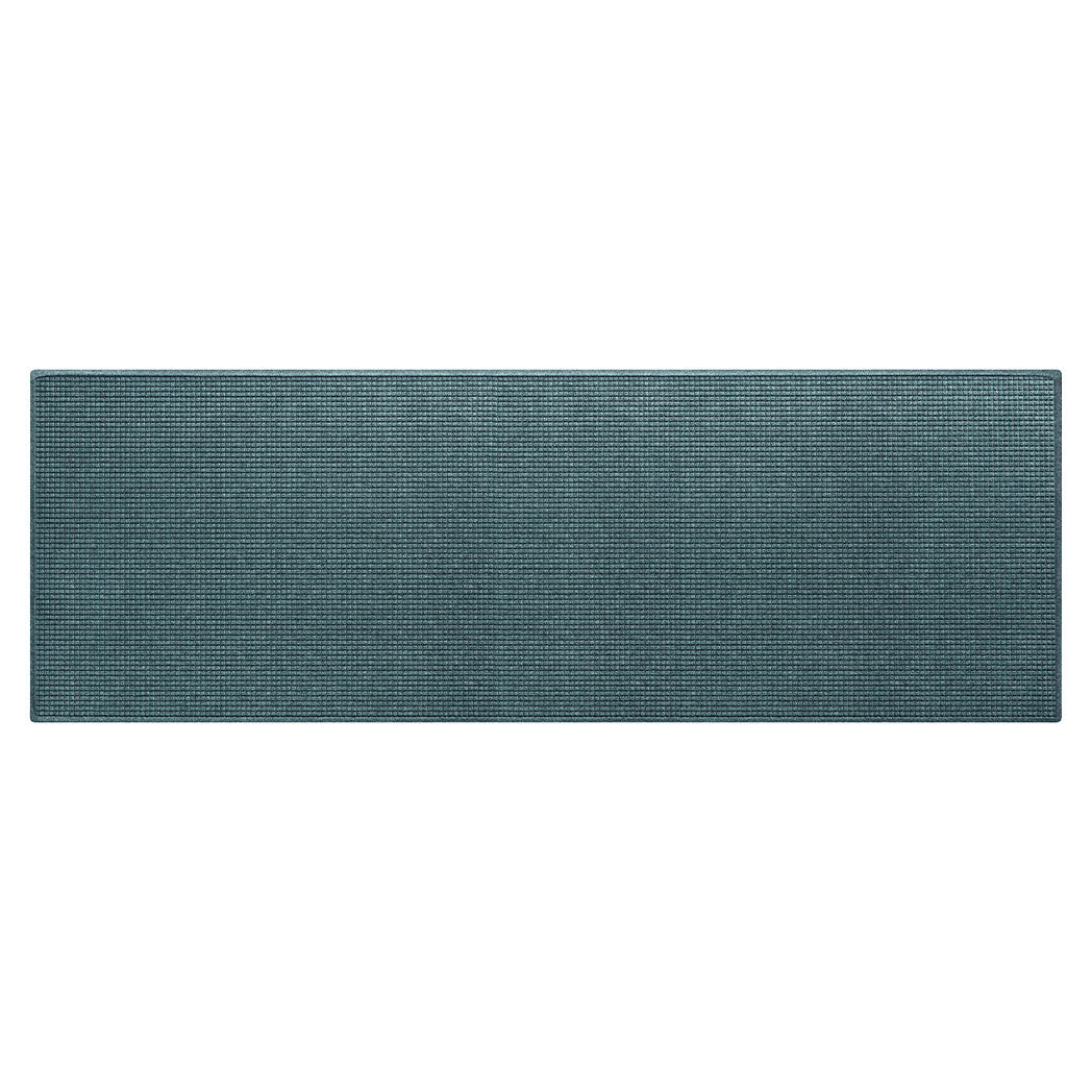 Overhead of a WaterHog Squares extra large and wide runner in a light blue/grey/green, stain-resistant surface.