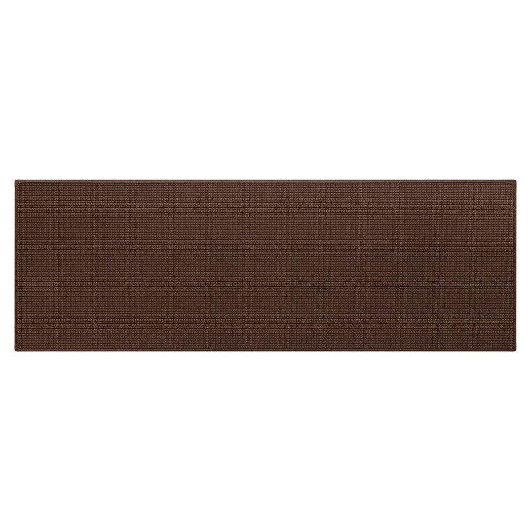 Overhead of a medium brown WaterHog extra large-sized outdoor runner mat in classic squares bi-level design on rubber backing made of recycled materials.