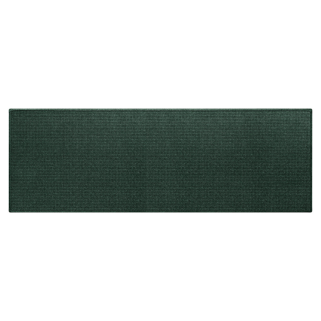 A genuine WaterHog extra large-sized outdoor runner mat with a deep green surface and rubber backing.