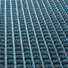 Detailed image of the all-weather WaterHog squares durable recycled PET surface made of dark and light blues, white and grey strands pressed into a beautiful bi-level design.