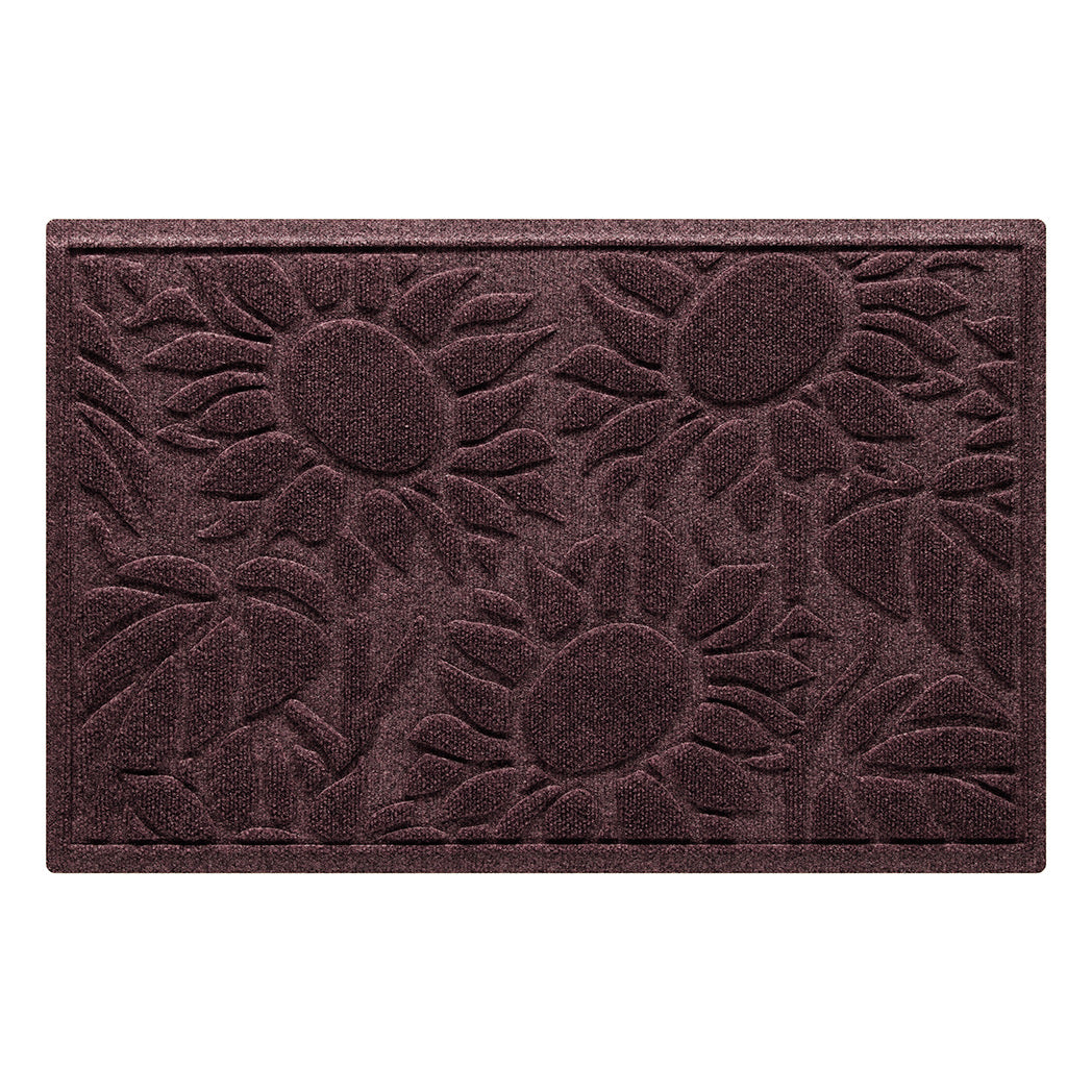 A cute Sunshine Day doormat shown in a single door, deep-wine red color with three staggered sunflowers, that's backed by WaterHog durable rubber backing.