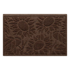 An overhead of a medium WaterHog Sunshine Day indoor/outdoor doormat in a warm brown color that features three sunflowers in a bi-level design for scraping and trapping dirt and moisture, shown on a white background.