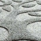 Detailed shot of the Tree of Life's surface, showing the eco-friendly surface fibers made of whites, greys, and even some blacks to accomplish the soft, medium grey color.