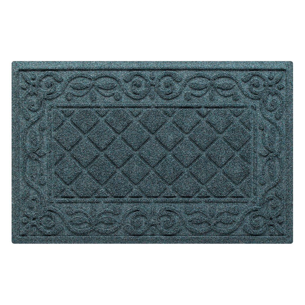 A medium Tristan WaterHog modern doormat in a dusty light blue that features the design of the classic diamond that is boarded by an ornate scroll design, all encased by a water dam border for holding water off your floors.