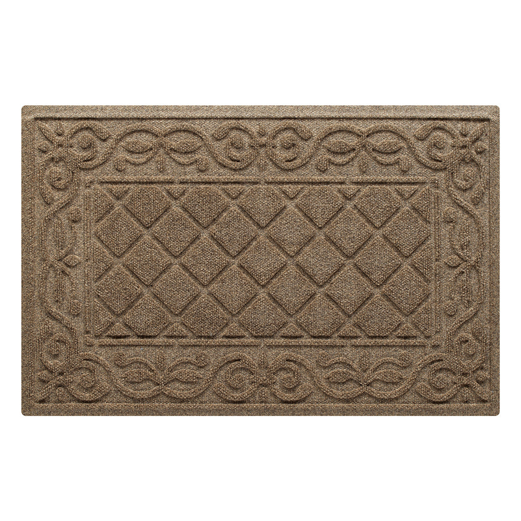 A tan WaterHog medium doormat in the two-part Tristan design - diamond pattern bordered by a scroll design, made from our fade-resistant surface fibers and backed by the beast of our in-house rubber backing.