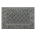 An overhead view of a classic medium grey Tristan doormat, which features an ornate scrollwork pattern that borders the classic, squared-off diamonds pattern in the center, in a single-door size, shown on a white background.