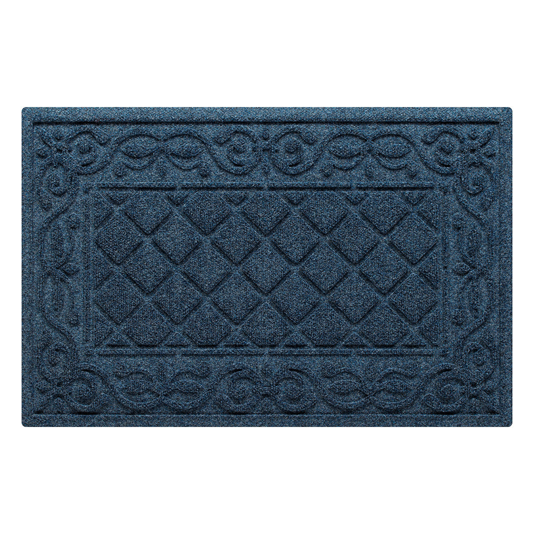 An overhead view of a medium, navy Tristan all-weather doormat, which features an ornate scrollwork pattern that borders the classic, squared-off diamonds pattern in the center; all in the a bi-level design and with a water dam border.