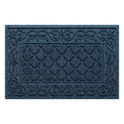 An overhead view of a medium, navy Tristan all-weather doormat, which features an ornate scrollwork pattern that borders the classic, squared-off diamonds pattern in the center; all in the a bi-level design and with a water dam border.