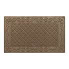 An overhead of a WaterHog Tristan large doormat in the tan camel color with a bi-level design of diamond pattern bordered by an elegant scroll design for scraping and trapping dirt and moisture from off your shoes and your floors.