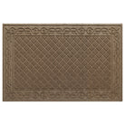 An XL WaterHog Tristan doormat in tan with a two-part bi-level design for scraping and trapping messes - a diamond pattern that is surrendered by an ornate scroll design.