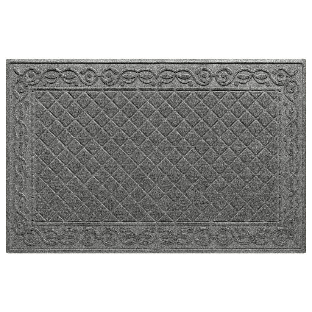 An overhead of a 4'x6' WaterHog Tristan indoor/outdoor doormat that feature the diamond pattern with an ornate border in a soft grey color, shown on a white background.