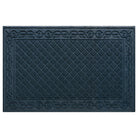 An XL WaterHog Tristan doormat in navy with a two-part bi-level design for dirt and moisture scraping and trapping - a diamond pattern that is surrendered by an ornate scroll design.