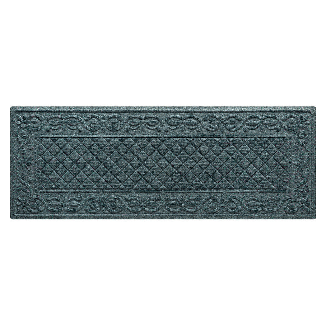 A WaterHog runner in the Tristan all-weather mat design shown in a deep navy color with a two-part design - an ornate scroll pattern boarding the classic diamonds pattern.